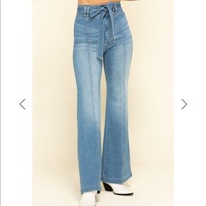 Flare jeans with bow belt tie